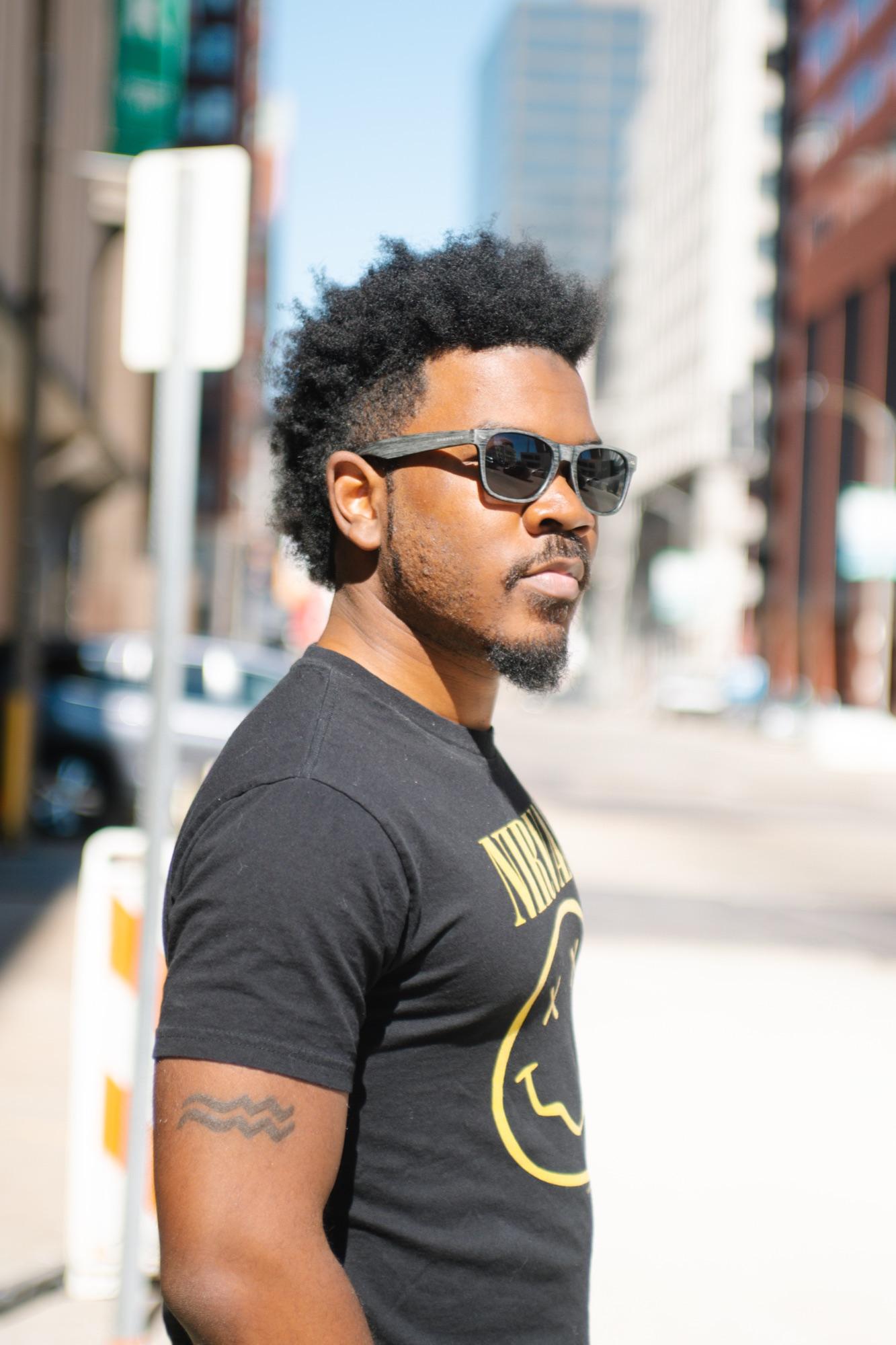 Golden-hour street profile in sunglasses