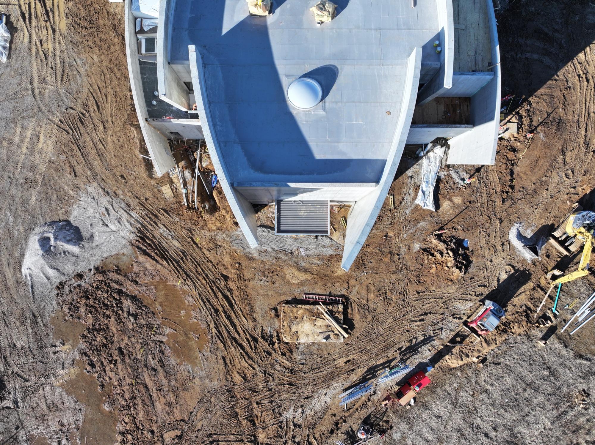 Top-down aerial of the sculptural curved BSI chapel roof under construction