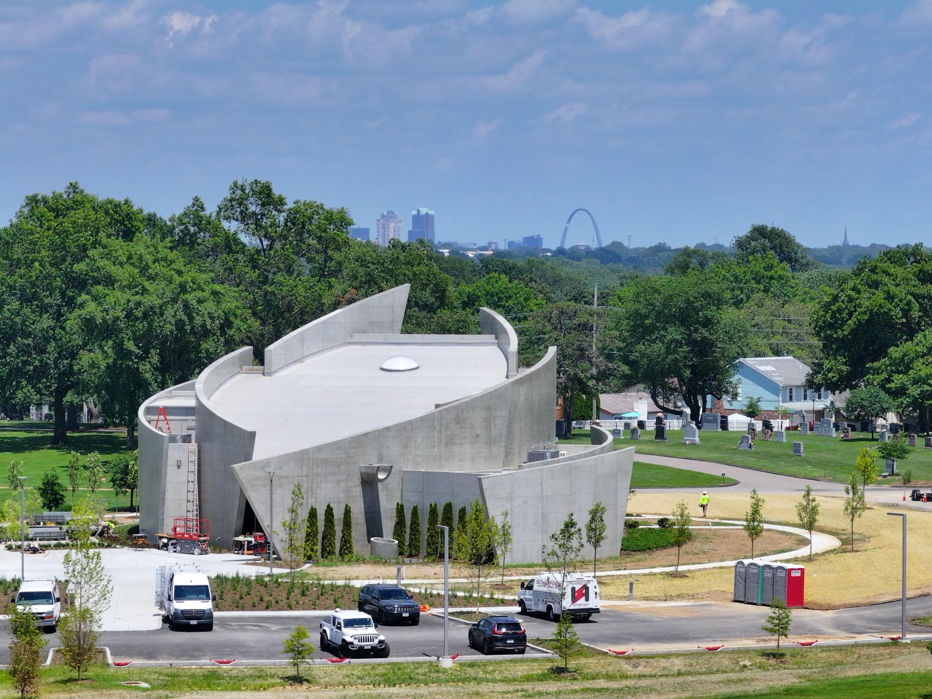 Modern building with St. Louis skyline and Gateway Arch in background