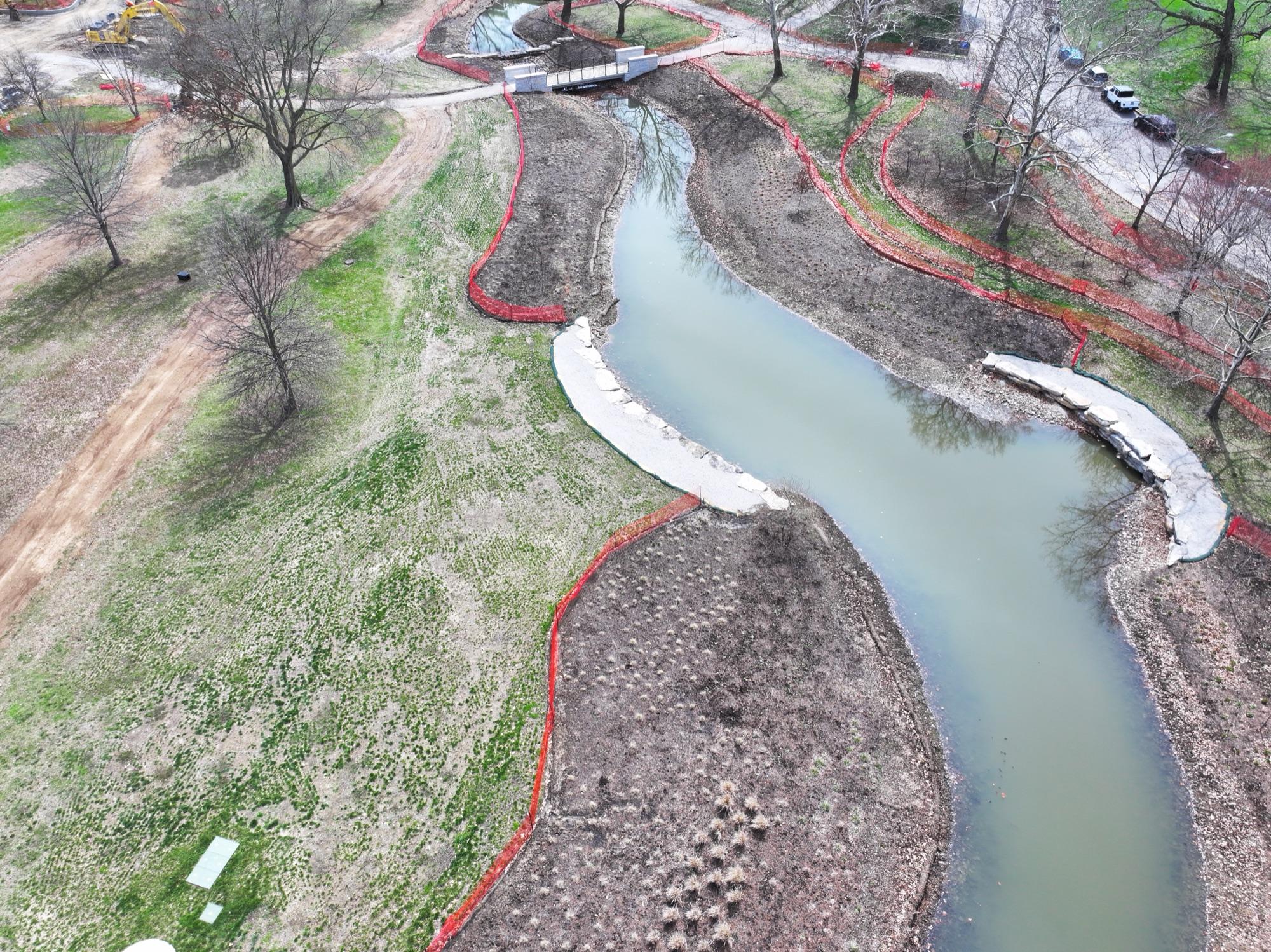 Steinberg waterway restoration from above — recontoured banks, stone crossings, and erosion control in Forest Park