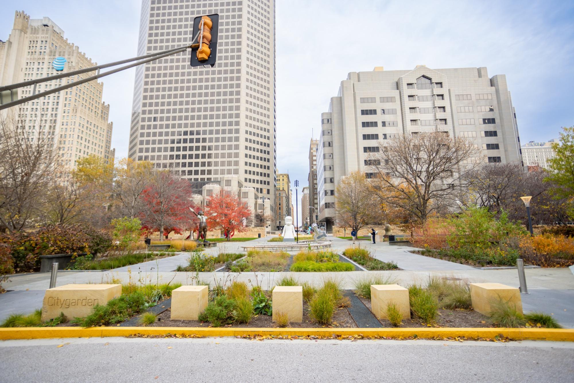 Citygarden sculpture park in fall color against downtown St. Louis towers