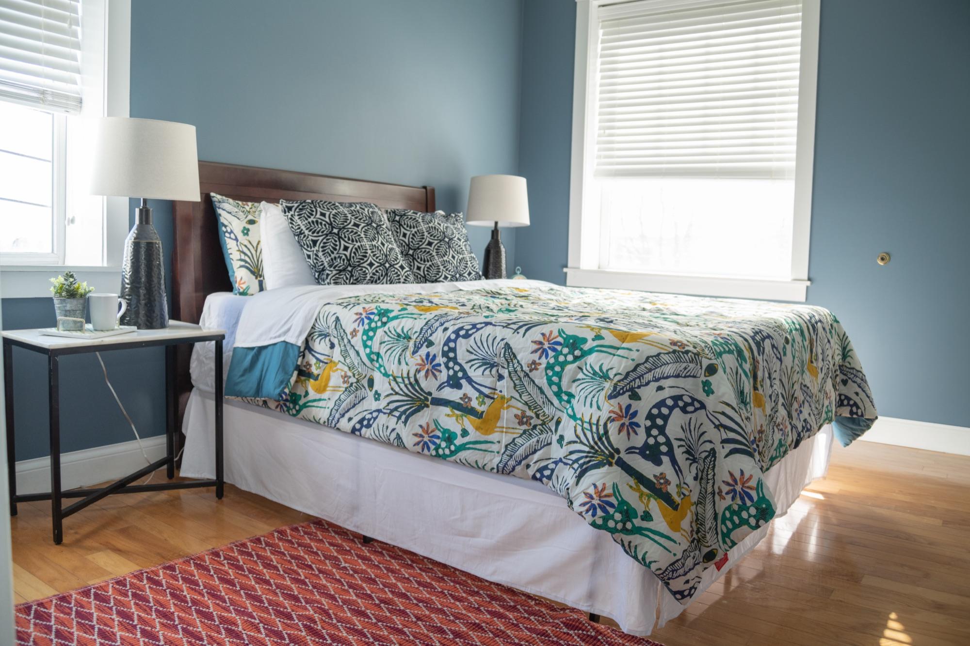 Styled bedroom with patterned bedding — listing interior